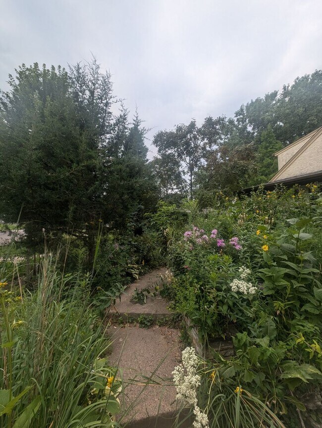 Building Photo - Charming Garden Oasis in West St. Paul – Fire Pit, Pond & Prime Location!