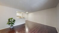 Located at 3815 Hideaway Bay Blvd in Kissimmee, FL, this well-designed one-bedroom, one-bathroom residence makes smart use of its single-floor layout. Rich, dark hardwood-style flooring runs throughout the home, creating a warm and cohesive aesthetic against the crisp white walls and textured ceilings.

The open-concept living, dining, and kitchen area forms the heart of the home. The living room is bright and airy, benefiting from large sliding glass doors that flood the space with natural light and provide direct access to a private patio with outdoor views. A pass-through peninsula connects the living area to the galley-style kitchen, which is outfitted with white cabinetry, light countertops, a full suite of white appliances, and a pantry for added storage.

The bedroom is a comfortable retreat, featuring a ceiling fan with light fixture, a window with views of the surrounding greenery, and generous closet space. The bathroom offers a clean, functional design with a wide vanity, dual mirrors, ample cabinet storage, and hardwood-style flooring that ties the space together.

Additional practical features include multiple closets throughout, a dedicated utility room, and a textured ceiling finish that adds subtle character. The overall ambiance is clean, bright, and move-in ready.