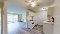 Located at 1420 Gregory St in Ypsilanti, Michigan, this one-bedroom, one-bathroom unit offers a well-utilized single-floor layout designed for efficient, comfortable living. Throughout the space, wood-look laminate flooring provides a warm, cohesive aesthetic that ties each room together.

The combined kitchen and living area forms the heart of the unit. The living room benefits from a large sliding glass door fitted with vertical blinds, allowing ample natural light and providing access to an outdoor area with views of the surrounding greenery. A ceiling fan adds both function and style to the space. The kitchen features white cabinetry, light speckled countertops, a gas range, refrigerator, dishwasher, and a stainless steel sink — offering all the essentials in a clean, efficient galley-style layout.

The bedroom is a comfortable, well-proportioned room with its own wall-mounted heating unit and a sliding glass door with vertical blinds, further enhancing natural light and outdoor access. The full bathroom is outfitted with a tub/shower combination, a vanity with generous counter space and cabinetry below, a mirrored medicine cabinet, and classic mosaic tile flooring. The building exterior features brick construction, reflecting the durable character of the property.