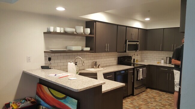 Modern kitchen with quartz counters and stainless - 520 4th St