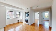 Located at 4124 Parkside Avenue, Unit 4F in Philadelphia's 19104 zip code, this two-bedroom, one-bathroom unit offers a well-designed layout across a single floor. Warm hardwood flooring runs throughout the main living areas and bedrooms, creating a cohesive and inviting atmosphere.

The kitchen is a standout feature, showcasing dark cabinetry with brushed silver hardware, light granite countertops, a classic subway tile backsplash, and white tile flooring. It is fully equipped with stainless steel appliances, including a refrigerator, electric range, and over-the-range microwave, providing a functional and stylish space for cooking.

The primary bedroom is a well-proportioned room featuring hardwood floors, white walls, and two windows that invite generous natural light and offer pleasant outdoor views of surrounding greenery. The second bedroom also features hardwood flooring and includes a closet, with access flowing naturally through the hallway.

The bathroom is finished with neutral tile on both the floor and tub surround, accented by a mosaic tile border detail, lending a clean and polished look. A dedicated entrance and hallway connect the rooms efficiently, contributing to the unit's practical flow. Overall, the space presents a clean, bright, and functional living environment.