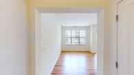 Located at 365 Lehigh Ave in Perth Amboy, NJ, this one-bedroom, one-bathroom unit offers a well-designed, single-floor layout that makes efficient use of its space. The living area features warm hardwood flooring and a large picture window fitted with vertical blinds, allowing abundant natural light and views of the surrounding neighborhood. The kitchen is thoughtfully appointed with warm-toned wood cabinetry, dark countertops, tile flooring, and a full suite of stainless steel appliances including a gas range, built-in microwave, and dishwasher — providing ample storage and workspace for everyday cooking. The spacious bedroom is finished with plush carpet and includes its own generous walk-in closet outfitted with wire shelving, offering practical storage solutions. The full bathroom features light tile flooring, a wood-cabinet vanity with a large mirror, and a well-lit overhead fixture that brightens the space. A dedicated hallway and entrance area complete the layout, providing a clear and functional flow throughout the unit. With neutral wall tones and consistent finishes, the space offers a clean, move-in-ready environment suited for comfortable everyday living.