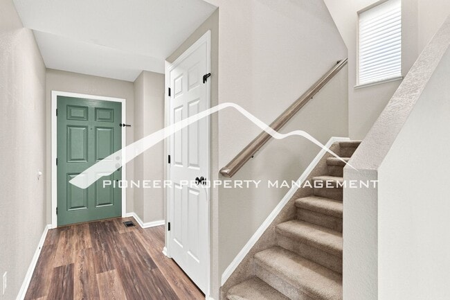 Building Photo - Spacious 4-Bedroom Home with a Finished Basement, 2 car garage, EV Charger and Low Maintenance, E...