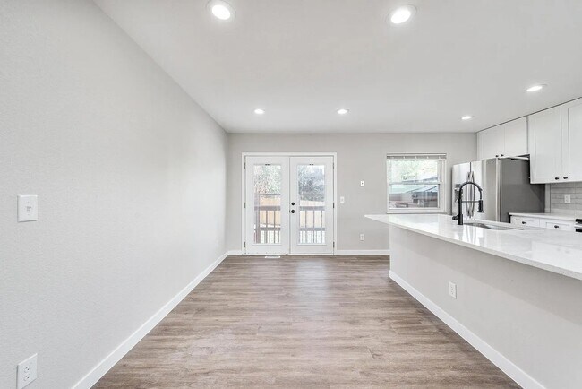The dining area allows for a sit down seating along with barstools - 18912 E Kansas Dr