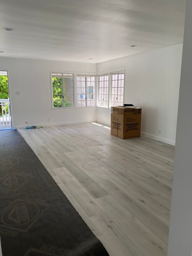 Living room while flooring being installed - 441 31st St