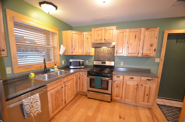 Building Photo - Year lease!  2 car garage, fenced yard, gr...