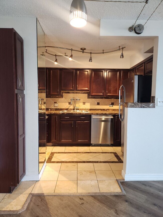 Building Photo - Affordable High Rise Condo in the heart of...