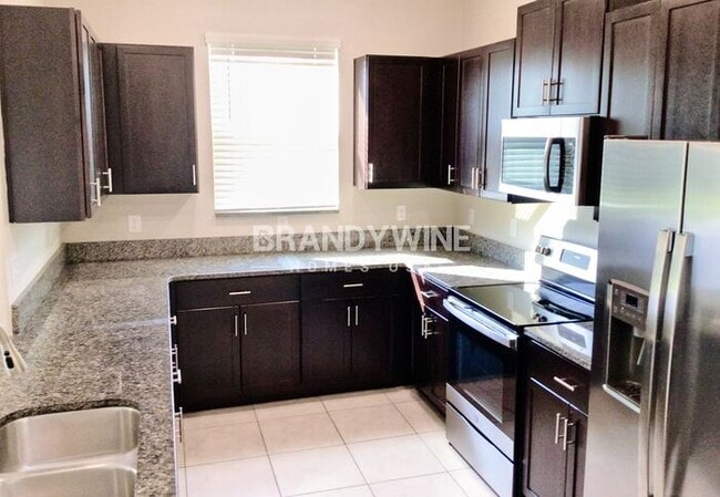 Building Photo - MOVE IN SPECIAL - BELMONT TOWNHOMES - AUGU...