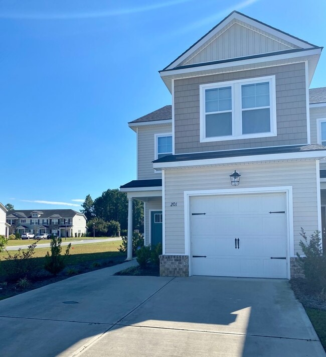 Building Photo - 3 bed/2.5 bath at end unit townhome in Berkeley Walk at Savannah Quarters with garage