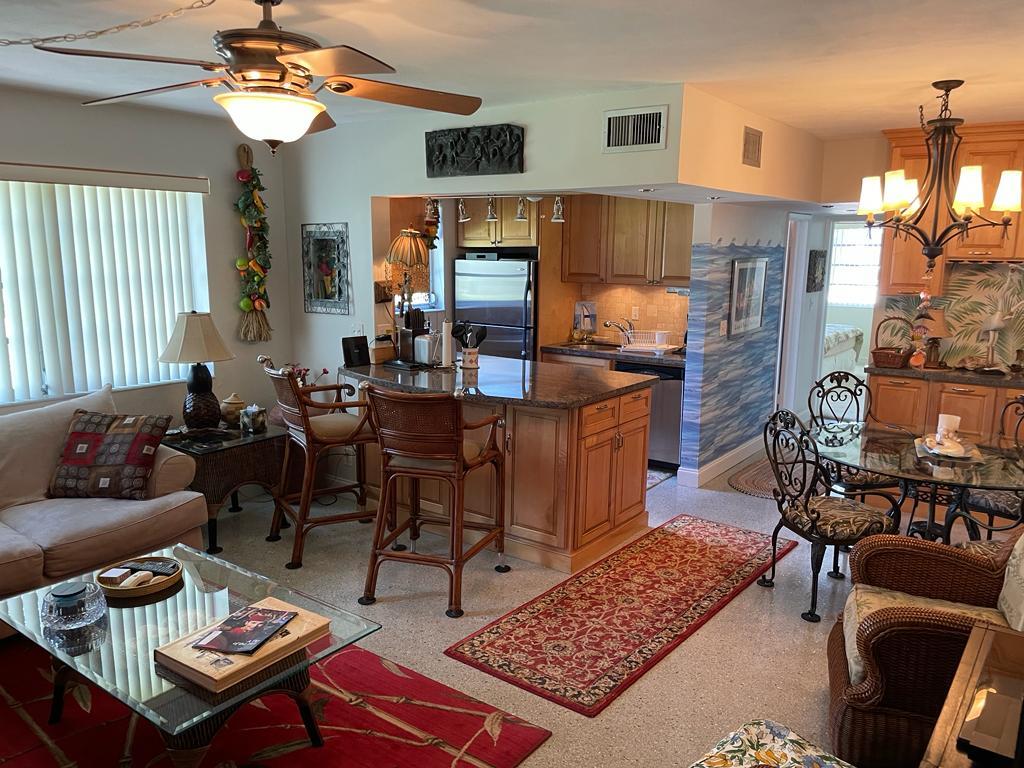 From the entrance: open kitchen with living room to the left and dining area to the right. - 700 Bayshore Dr