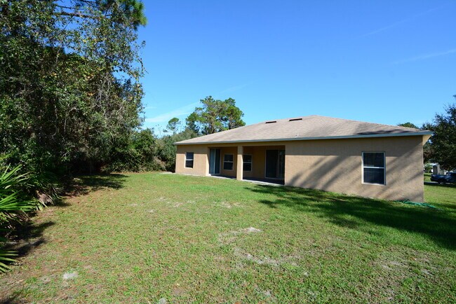 Building Photo - "Spacious 4-Bed Oasis in Palm Coast with 2...