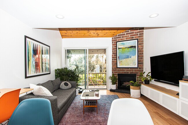 balcony feat. teak decking, new stainless BBQ, cafe table/chair set, & views over treetops/rooftops - 8740 Tuscany Ave
