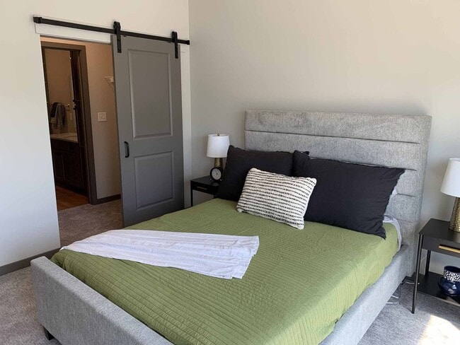 Our cozy bedrooms are designed for comfort and style, creating the perfect retreat after a busy day. - Haven at Uptown