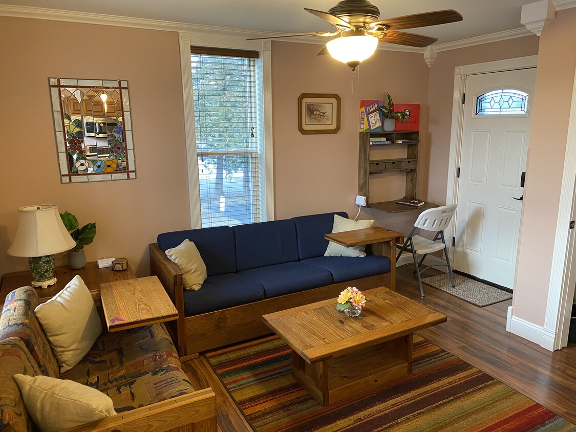 Living room showing desk open and chair in place. - 309 N Davison St