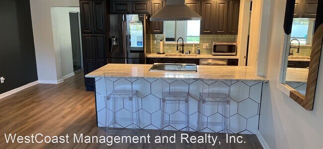 Building Photo - 4 br, 2.5 bath House - 8902 W. Cluster Ave.