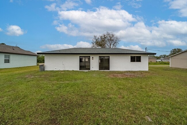Building Photo - Charming Palm Bay Retreat - Perfect for Relaxation and Entertainment!