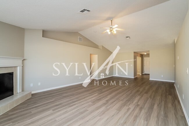 Building Photo - The living is easy in this 4 bedroom, 2 ba...