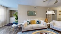 Located at 2603 Silkwood Circle in Orlando, Florida, this single-story, 2-bedroom, 2-bathroom home offers a well-designed layout that maximizes every square foot. The open-concept living, dining, and kitchen area serves as the heart of the home, bathed in natural light from large windows dressed with sheer curtains. The living room features wood-look flooring, a ceiling fan, and generous space for comfortable furnishings. The kitchen is a standout, boasting white shaker cabinetry, a subway tile backsplash, stainless steel appliances, and a granite-topped peninsula with bar seating and elegant pendant lighting — ideal for casual dining and entertaining. The primary bedroom is a comfortable retreat with carpet flooring, a natural-light window, and access to a spacious walk-in closet outfitted with wire shelving. The second bedroom is equally well-appointed, also featuring carpet and a bright window. Both bathrooms include tub/shower combinations with clean white tile surrounds. Five closets throughout the home provide exceptional storage. A dedicated laundry area adds everyday convenience. The home's neutral palette and consistent finishes create a cohesive, move-in-ready atmosphere throughout.