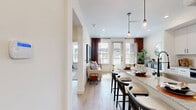 Located at 405 E Ash St in Celina, TX, this thoughtfully designed one-bedroom, two-bathroom residence delivers a clean, modern aesthetic across a single floor. The open-concept kitchen is a standout feature, showcasing crisp white shaker cabinetry with matte black hardware, granite countertops, stainless steel appliances, a subway tile backsplash, and a generous island with seating — all illuminated by stylish pendant lighting. The kitchen flows naturally into the living room, which is bathed in natural light through large windows and a glass door that opens to an outdoor area. Light wood-look flooring runs throughout the main living spaces, lending a warm, cohesive feel. The bedroom is a comfortable retreat, featuring plush carpeting, multiple windows with natural light, and a ceiling fan. Both bathrooms are appointed with white cabinetry, granite vanity countertops, and matte black fixtures. The full bath includes a tiled tub-shower combination. A dedicated closet and hallway complete the layout. The interior palette of crisp whites and neutral tones creates a bright, airy ambiance throughout, making this Celina residence a compelling and functional home.