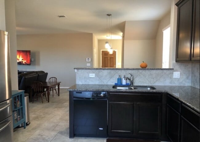 Building Photo - "Spacious 4-Bedroom Retreat with Granite Countertops & Private Movie Room in Selma, TX!"