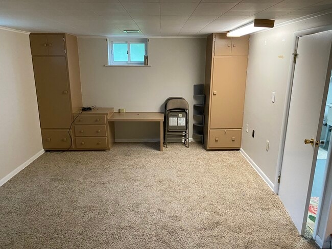 Basement den with built in cabinets - 1011 Woodland Dr