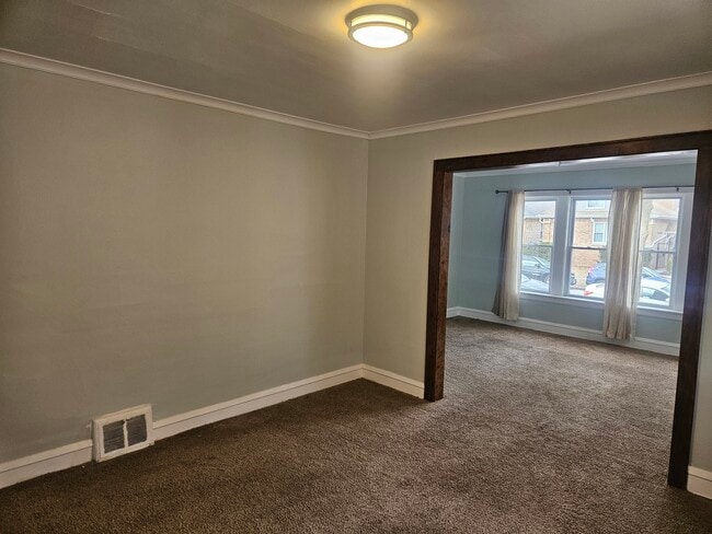 Building Photo - 6125 W Newport Ave