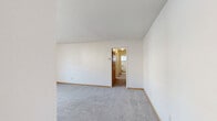 Located at 4408 Chowen Ave S in Minneapolis, Minnesota, this single-floor, 3-bedroom, 1-bathroom home offers a practical and well-organized layout. The spacious primary bedroom features soft carpeting and direct access to the full bathroom, which includes a vanity with wood cabinetry, a tub-shower combination, and a window that brings in natural light. The two additional bedrooms are both carpeted and equipped with ceiling fans, mirrored sliding closet doors for storage, and windows with blinds that allow for natural light. Baseboard heating is present throughout the home. The kitchen is efficiently designed with warm wood cabinetry, granite-style countertops, light hardwood-style flooring, and black appliances including a gas range, microwave, and a stainless steel refrigerator. A ceiling fan adds airflow to the kitchen area. The open living area is carpeted and connects seamlessly to the kitchen, creating a cohesive and functional common space. A hallway ties all rooms together in a straightforward single-floor plan. Clean white walls and wood-toned trim details are consistent throughout, giving the home a simple, neutral aesthetic suited for a variety of lifestyles.