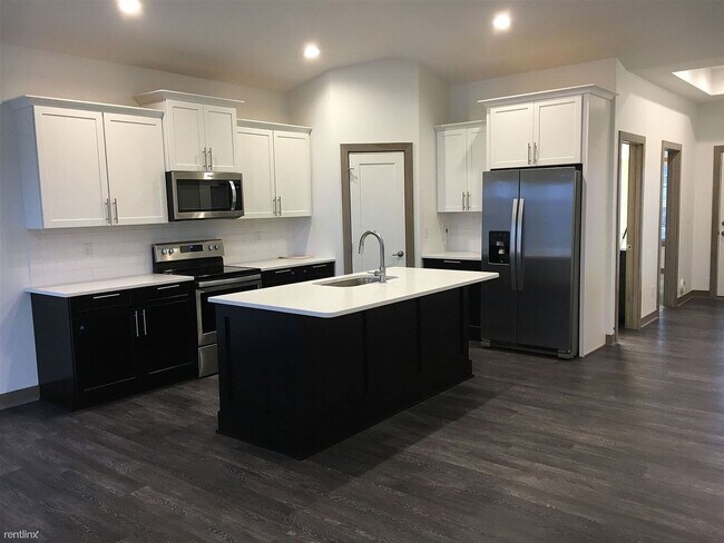 Building Photo - Spacious 4 bedroom/3 bath home with finished lower level and attached 2 car garage