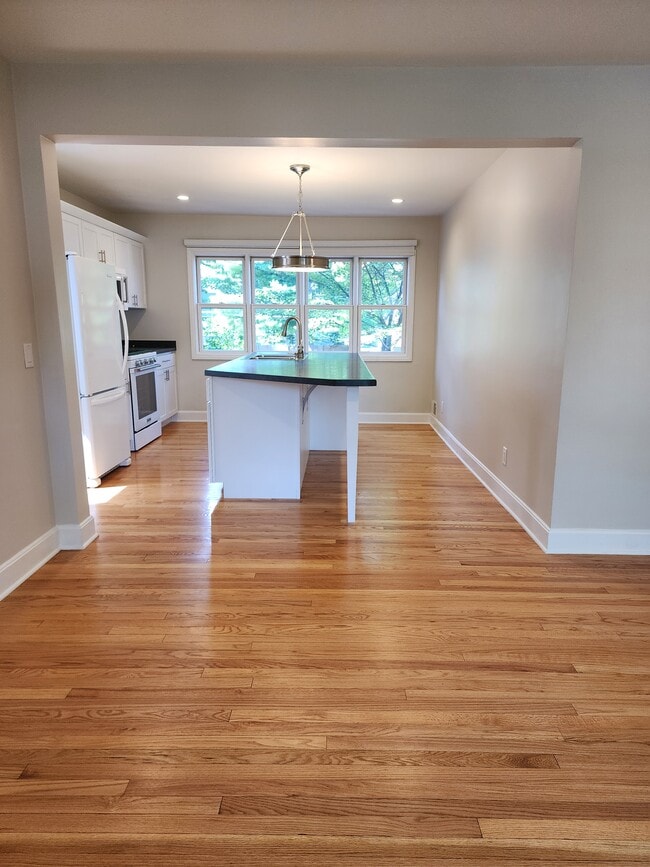 Bright kitchen with island seating. - 316 S Charter St