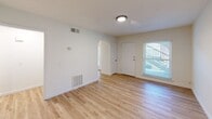 This well-designed 560 square foot apartment in Red Bank, Tennessee, maximizes space efficiency without compromising on comfort. The single-floor layout encompasses one bedroom, one bathroom, a living room, dining area, and kitchen, all connected by a central hallway.

The apartment boasts modern finishes throughout, with gleaming hardwood floors that unify the space and create a warm, inviting atmosphere. Crisp white walls and trim work provide a clean, contemporary backdrop, while large windows in each room flood the interior with natural light, enhancing the sense of spaciousness.

The primary bedroom, measuring a generous 180 square feet, offers ample space for a comfortable retreat. The living and dining areas flow seamlessly, ideal for entertaining or relaxation. The kitchen, while compact, features white cabinetry, granite countertops, and stainless steel appliances, including a full-sized refrigerator.

The bathroom is efficiently designed with a shower/tub combination and modern fixtures. Throughout the apartment, recessed lighting and ceiling fixtures provide additional illumination. Practical amenities such as closet space and a heating/cooling system ensure comfort and convenience.

This apartment's thoughtful design and location at 3204 Redding Rd make it an attractive option for those seeking a cozy, low-maintenance living space in the Red Bank area.