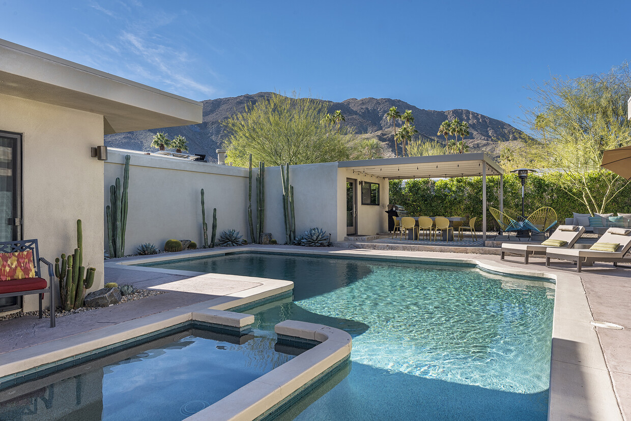 Relax and recharge in this spacious, secluded backyard with gorgeous mountain views and a large pool - 71535 Biskra Rd