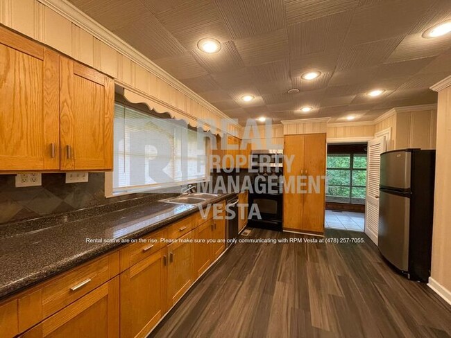 Building Photo - Centrally Located with Wooded, Secluded Lot
