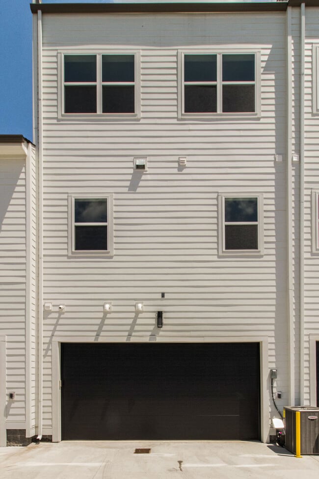 Back of the home with remote and wall mounted garage door access - 707 Vernon Ave