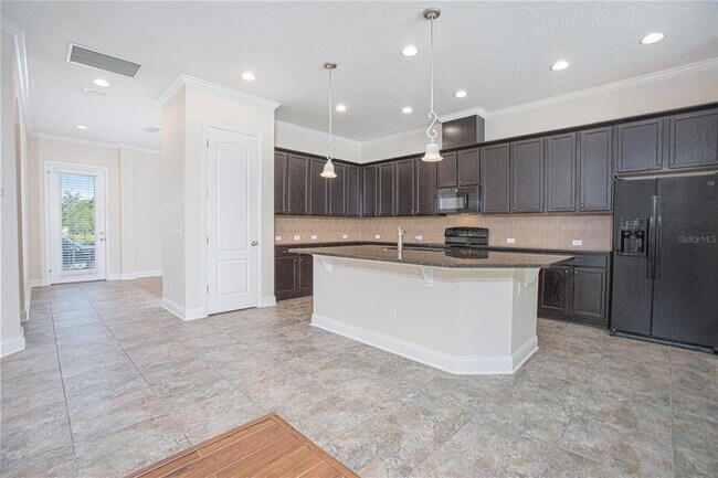 Building Photo - 8556 Tavistock Lakes Blvd