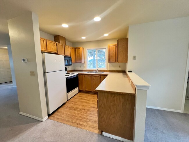 Building Photo - Corner Condo Unit with Private 1-Car Garage