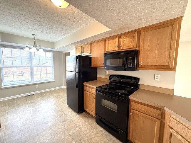 Building Photo - LARGE 2 Bedroom 2 1/2 Bath Townhome with Full Finished Basement and 1 Car Garage