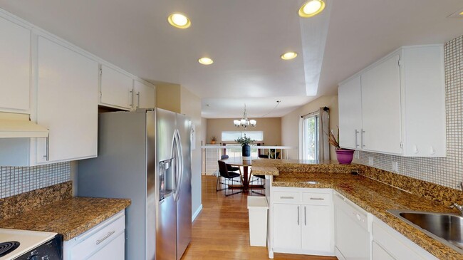 Building Photo - Room in 4 Bedroom Home at 7737 Nightingale...