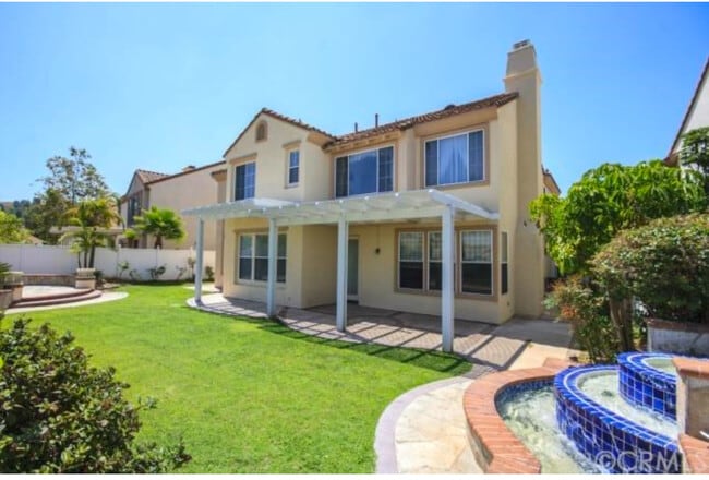 Grass has been replaced with beautiful flagstone which is low-maintenance - 2558 Carlton Pl