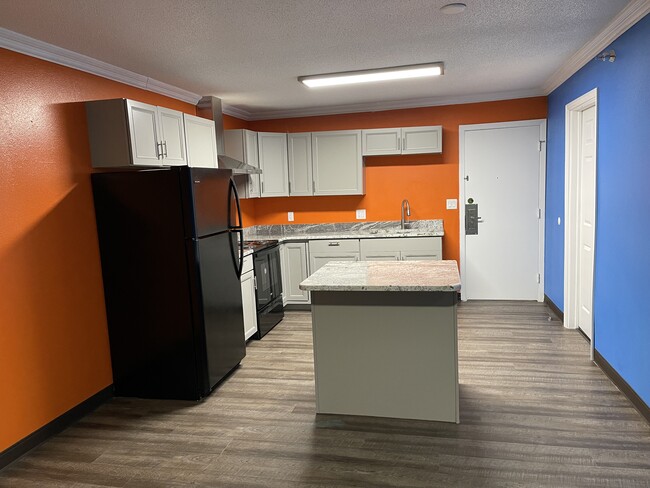 KITCHEN WITH ISLAND - 635 8th Ave SW