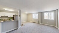 Located at 3801 Conshohocken Ave in Philadelphia, PA, this 2-bedroom, 1-bathroom unit offers a well-designed single-floor layout with a practical and comfortable flow throughout. The kitchen is a standout feature, outfitted with white shaker-style cabinetry, granite countertops, stainless steel appliances including a gas range, microwave, and refrigerator, and durable wood-look flooring. A peninsula counter opens toward the living area, making it ideal for casual dining or entertaining. The spacious living room is bathed in natural light from multiple windows dressed with vertical blinds, and features soft wall-to-wall carpeting and a baseboard heating unit. The primary bedroom is generously sized, with plush carpeting, a large sliding-door closet, and access to a private balcony with outdoor views. The second bedroom also offers carpeted flooring, neutral tones, and ample space. A dedicated closet provides additional storage. The full bathroom includes a tub-shower combination with clean white tile surround and chrome fixtures. Throughout the unit, neutral gray walls, white trim, and consistent finishes create a cohesive, move-in-ready aesthetic.