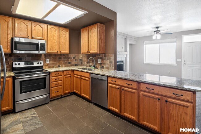 New Granite with extra soft close cabinet space and under mounted sink. - 1089 S Walden Way