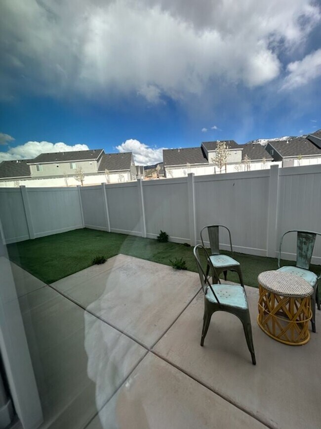 Building Photo - Three bedroom, 2.5 bath townhome