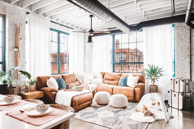 Huge living room with large windows, exposed brick and beams - 2987 Franklin St
