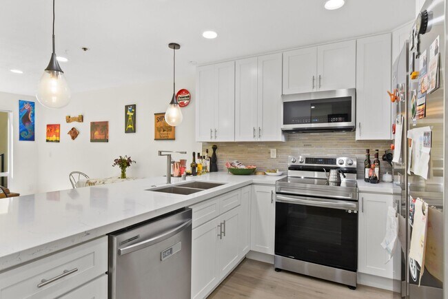 Building Photo - Modern Living Meets Urban Charm in Bankers...