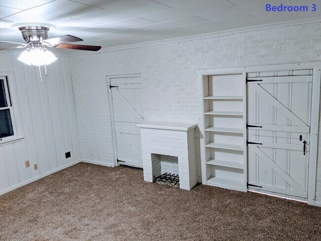 Master 3rd bedroom with Faux Fireplace, Fan, and built-ins. Or use it large living/dining room. - 2011 N Burns