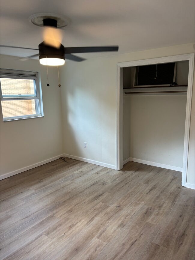Bedroom 1 - ceiling fan and new LVT flooring - 244 Clairmont Ave