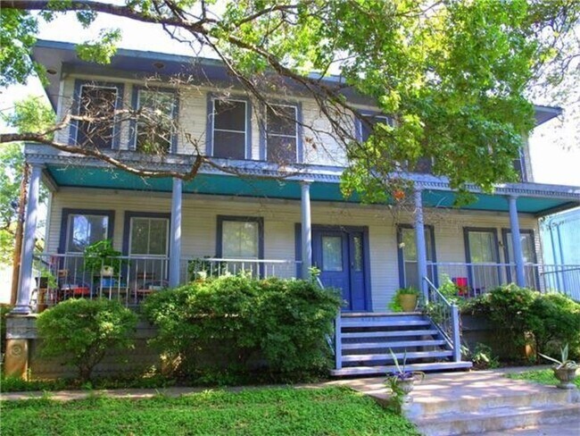 front of 4-plex house with shared porch - 402 W 44th St