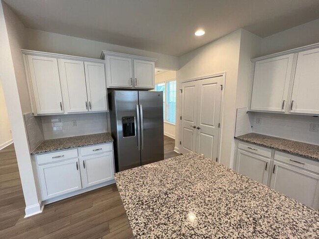Building Photo - LIKE NEW 4 Bedroom Home w/ Ground Floor Be...