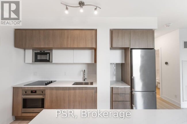 Building Photo - 1-601 Belsize Dr