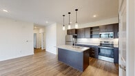 Step into a world where comfort meets sophistication in this exquisite 950 square foot haven. This single-story gem boasts three bedrooms, including a spacious 160 square foot primary suite, perfect for creating your personal sanctuary. The heart of the home is a breathtaking open-concept kitchen and living area, where culinary dreams come to life amidst sleek, dark wood cabinetry and gleaming stainless-steel appliances. The island, crowned with a luxurious granite countertop, invites casual dining and lively conversation.

Warm, wood-look flooring flows seamlessly throughout, creating a cohesive and inviting atmosphere. Large windows in every room bathe the space in natural light, offering picturesque views and a constant connection to the outdoors. The two thoughtfully designed bathrooms feature modern fixtures and ample storage, ensuring both style and functionality.

Energy-efficient ceiling fans and recessed lighting add to the home's contemporary appeal while promoting comfort and sustainability. With its clean lines, neutral palette, and attention to detail, this home is a blank canvas awaiting your personal touch. Located in the desirable Kalamazoo area, 5141 N Wagon Trail isn't just a house – it's an opportunity to elevate your lifestyle and make your homeownership dreams a reality. Welcome home to modern living at its finest.